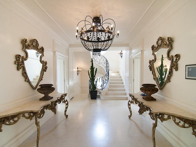 the-entrance-way-has-a-very-unique-chandelier