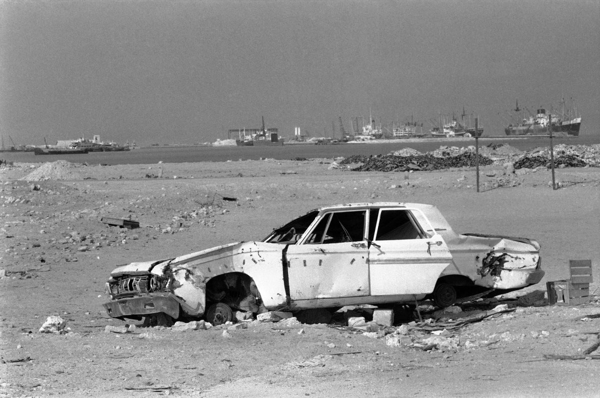 then-a-discarded-plymouth-convertible-american-car-is-seen-on-the-outskirts-of-the-city-in-1977-