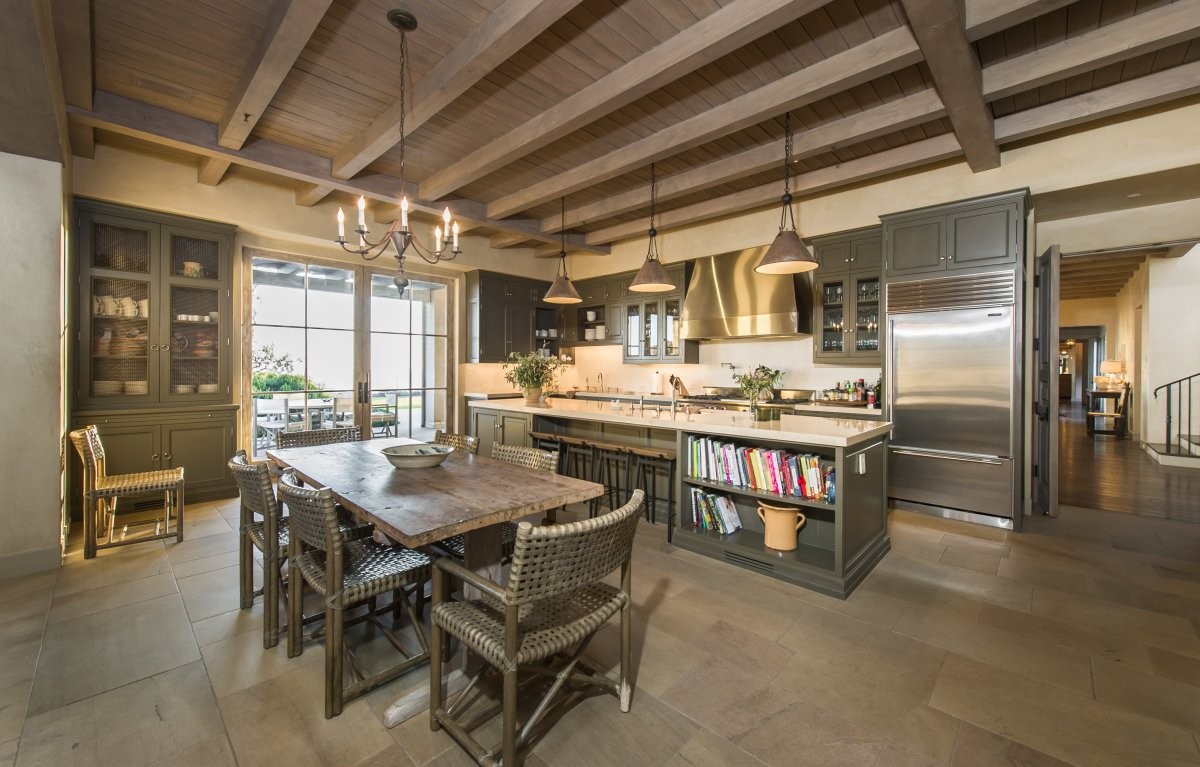 the-kitchen-also-has-plenty-of-space-for-seating-with-a-six-person-table-and-stools-at-the-count