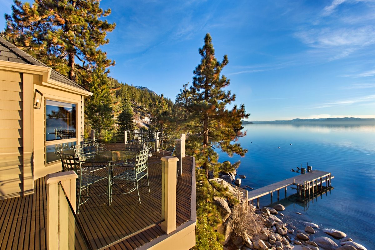 a-large-lakefront-deck-is-perfect-for-enjoying-sunny-afternoons-or-entertaining-guests