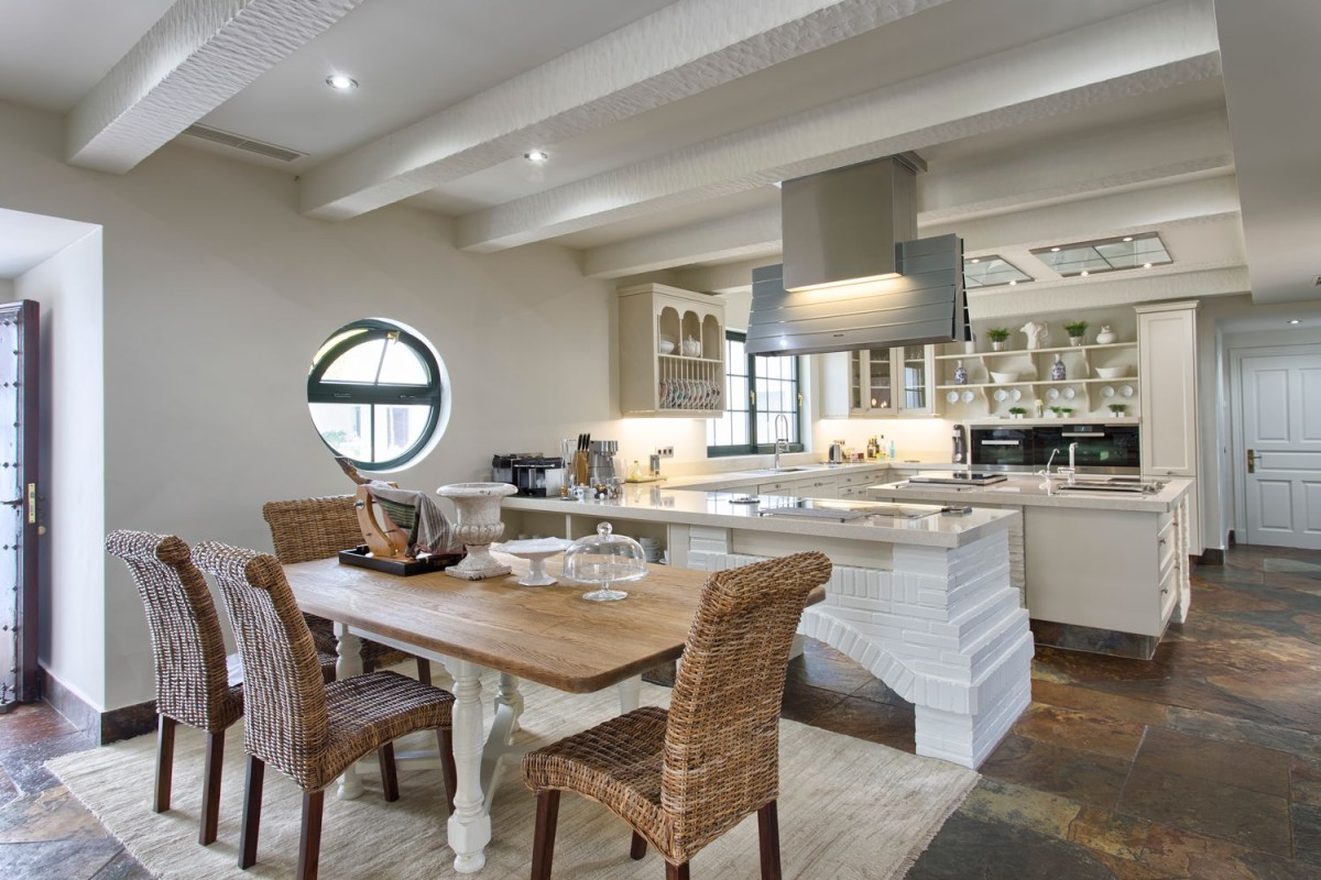 The villa has a large kitchen with adjoining dining area