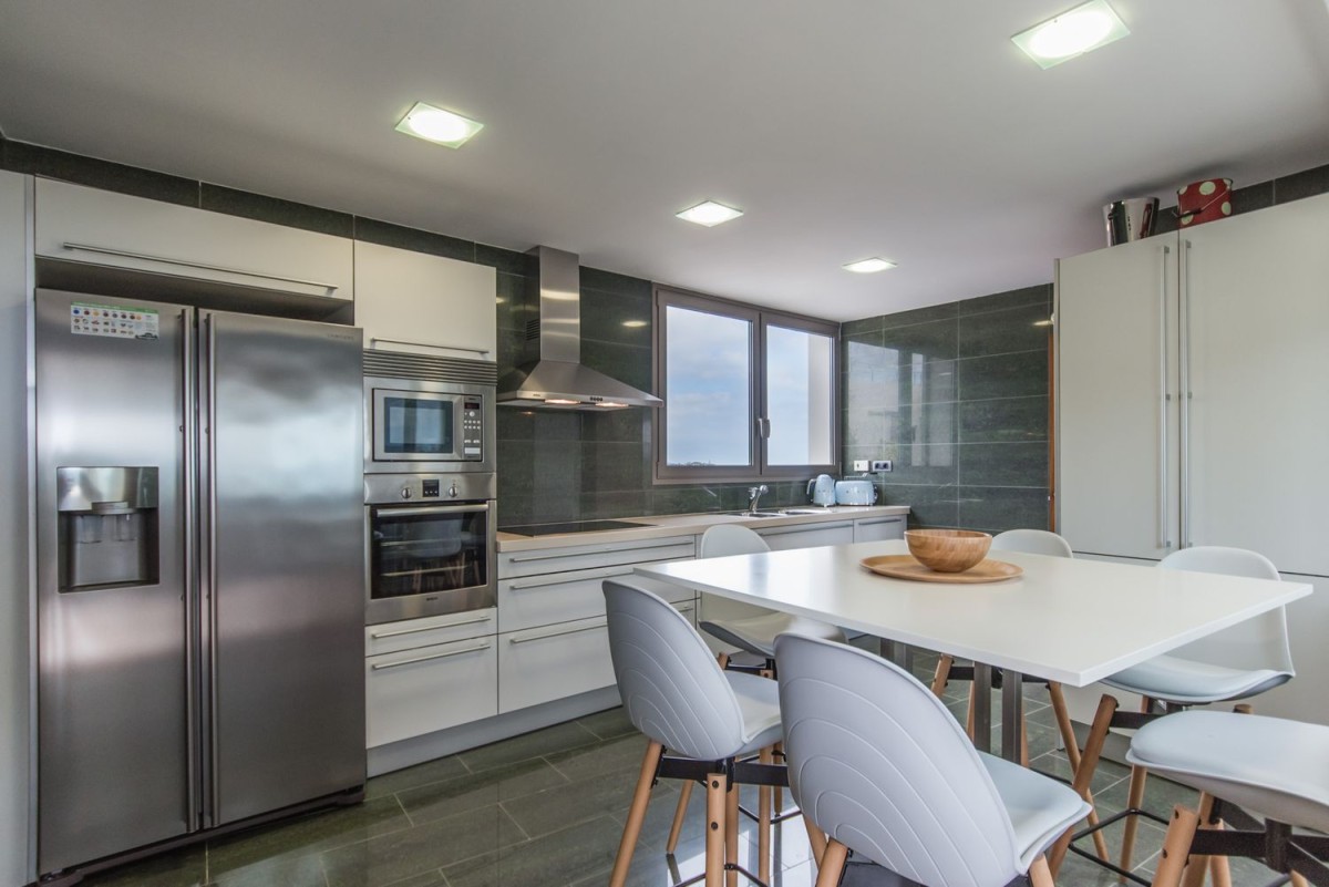 The kitchen is modern, bright and spacious The kitchen is modern, bright and spacious