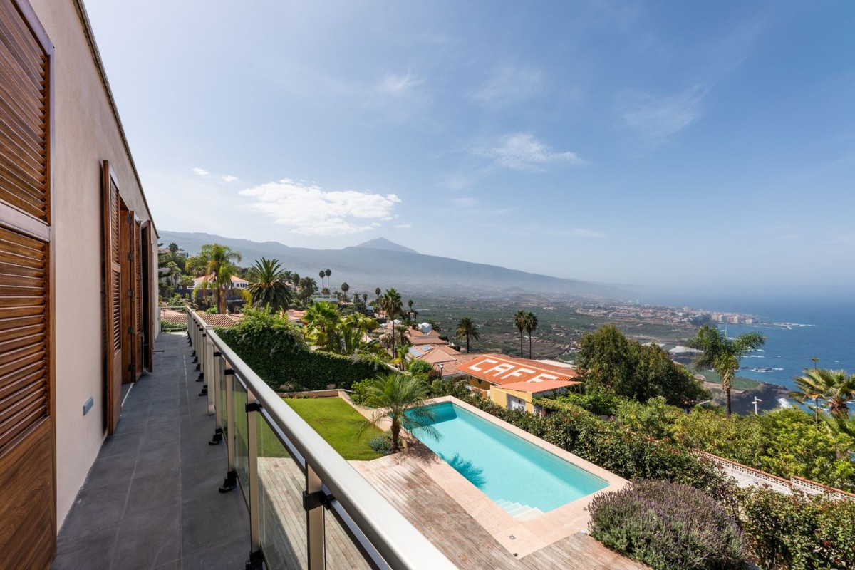A balcony surrounding the property is the perfect spot to enjoy the views