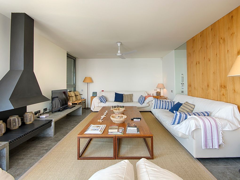 The living room has a feature fireplace and direct terrace access The living room has a feature fireplace and direct terrace access