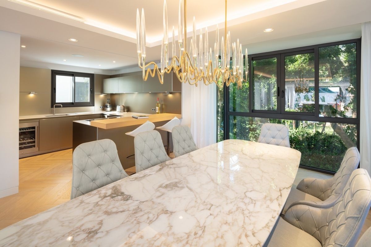 The kitchen/dining area is modern and bright