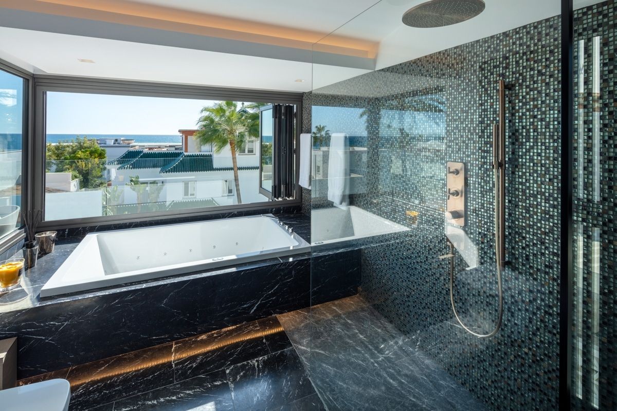 The luxury master bathroom is home to stunning views