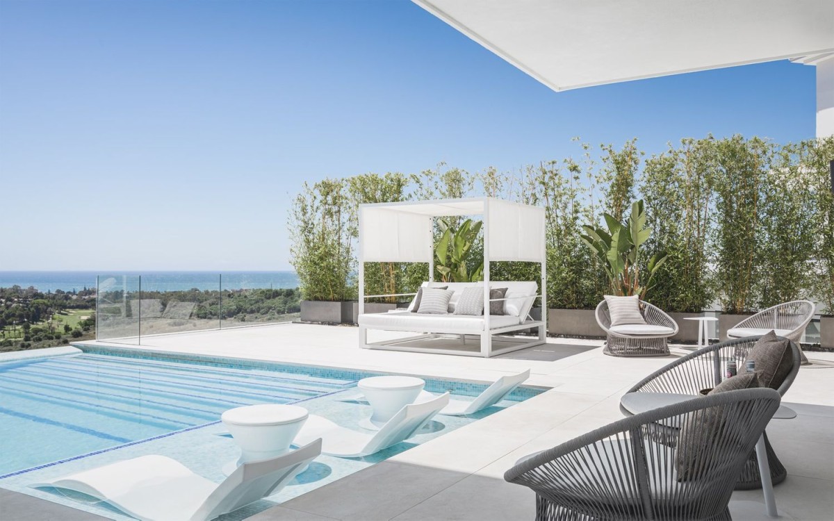 The pool area has plenty of space for relaxing and enjoying the sun
