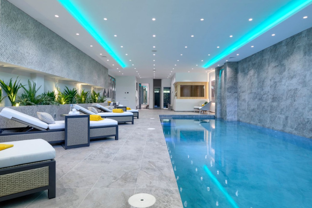 As well as a home cinema and gym, the property also has an indoor pool As well as a home cinema and gym, the property also has an indoor pool