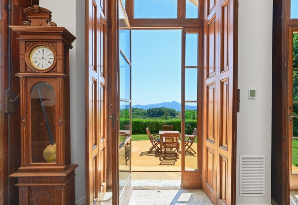 The property has large doors which open onto a large garden with stunning views