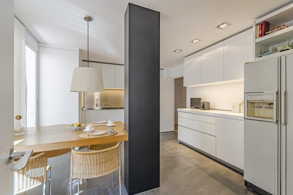 The kitchen is an expansive, modern space