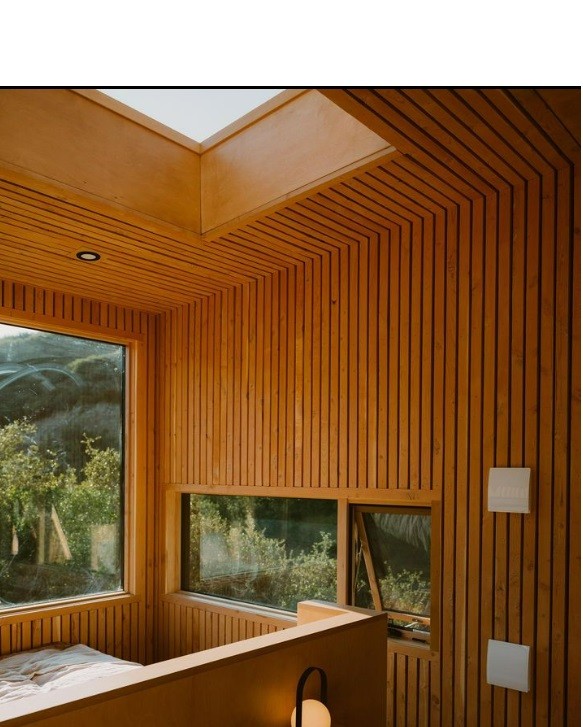 Dormitorio con ventanas a la naturaleza