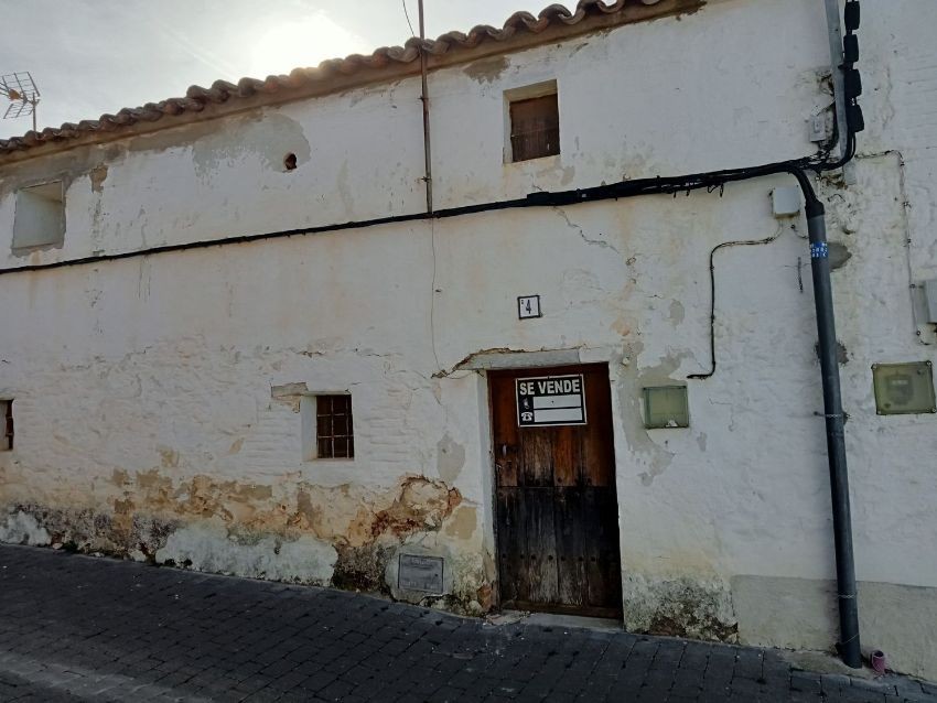 Which village in Spain is offering a job and free housing?