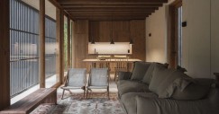 Salón con cocina al fondo y ventanales